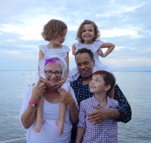A photo of Susan Delise and Juan Williams with their grandchildren. 